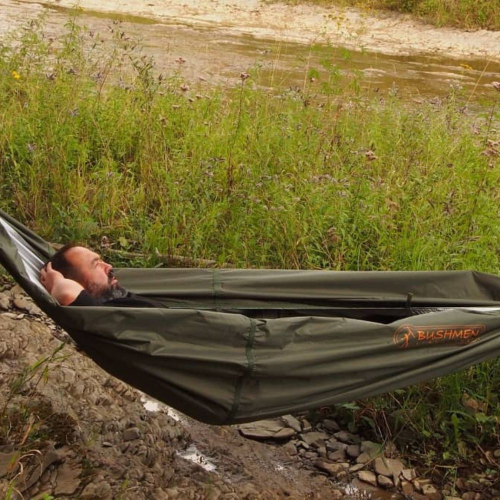thermo-tarp used as hammock near a river.