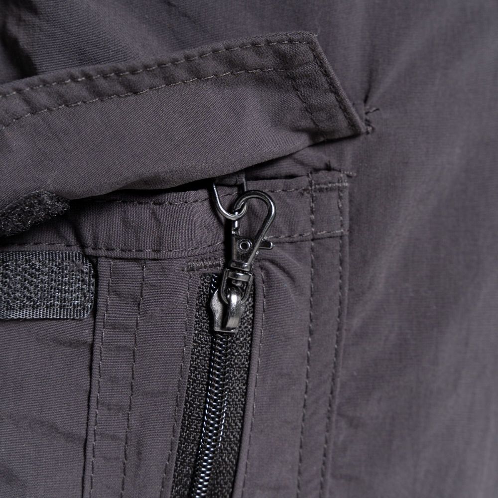 Detailed view of the secure side pocket zipper on Men's NosiLife Cargo II Trousers in black pepper.