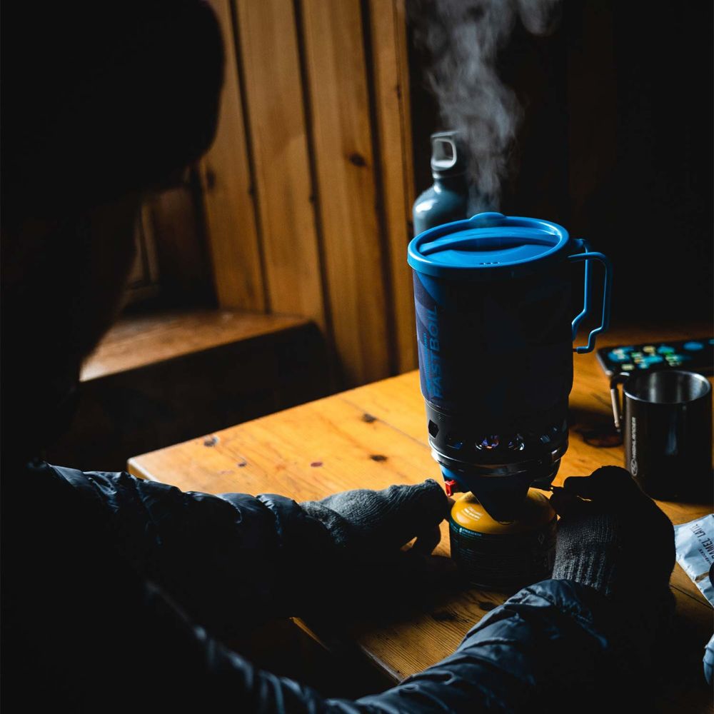 Top view of blade fastboil 3 camping gas stove with blue lid.