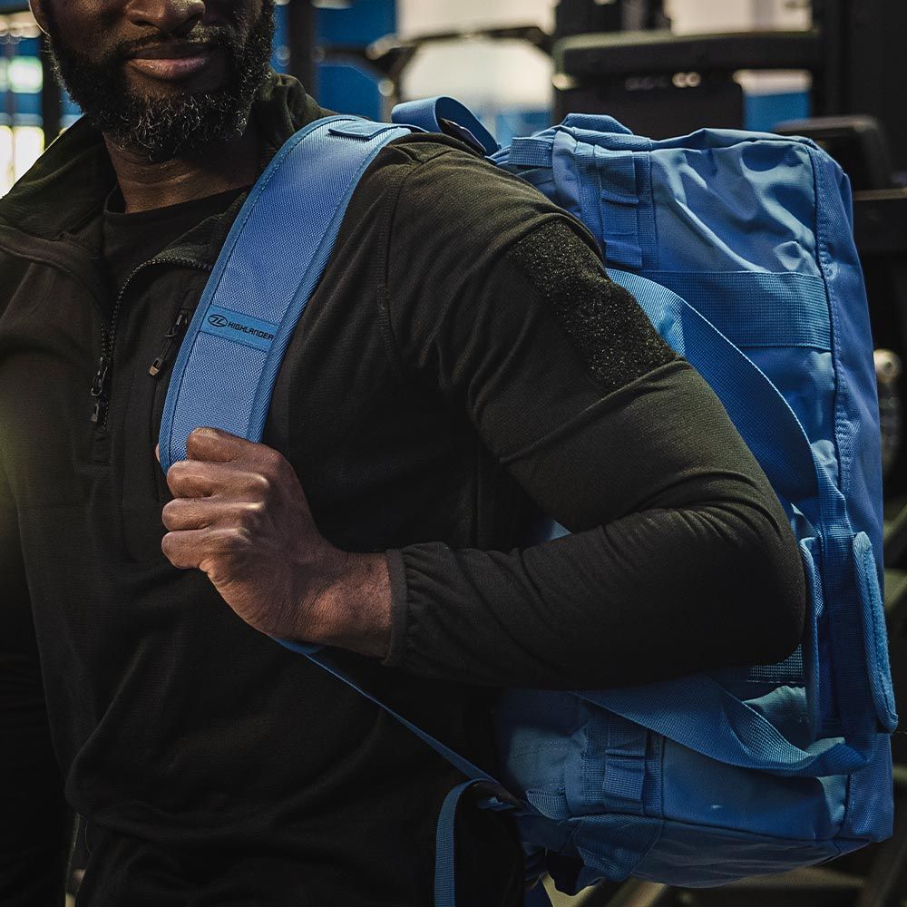 Man carrying Storm Kitbag Duffle as a backpack.