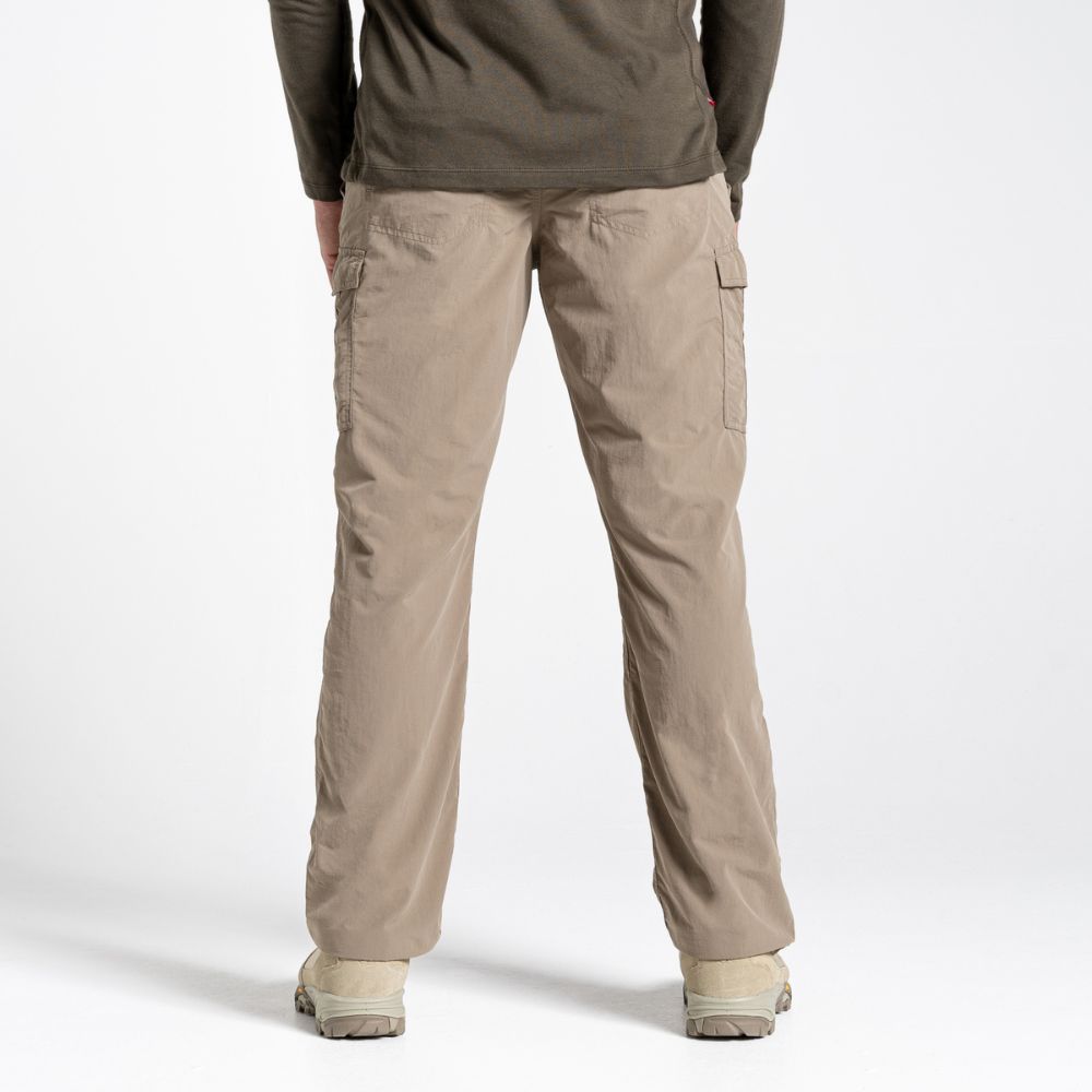 Back view of pebble-colored Men's NosiLife Cargo II Trousers highlighting the elastic waistband.