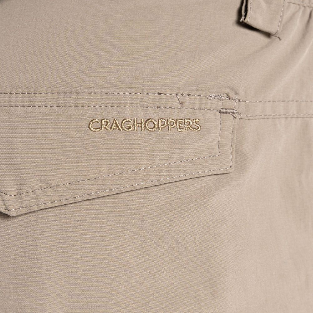 Close-up of Craghoppers logo on the back pocket of Men's NosiLife Cargo II Trousers.